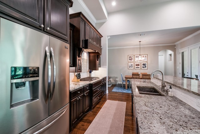 4111 Monteverde Run, San Antonio, TX 78261 - kitchen with tasteful backsplash, ornamental molding, appliances with stainless steel finishes, arched walkways, and a sink