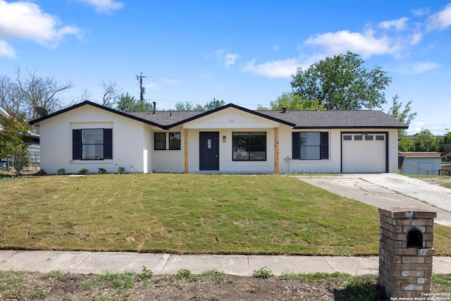 single story home with a front yard, a shingled roof, an attached garage, brick siding, and driveway