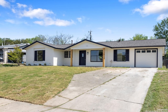 ranch-style home with a garage, a front lawn, brick siding, a shingled roof, and driveway