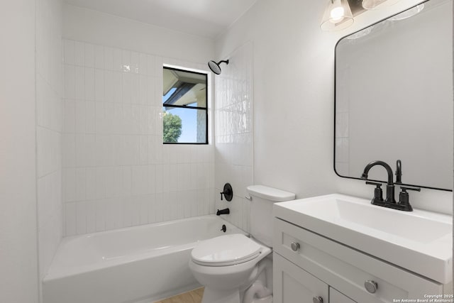 bathroom with vanity, toilet, and tub / shower combination