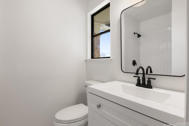 bathroom with toilet and vanity