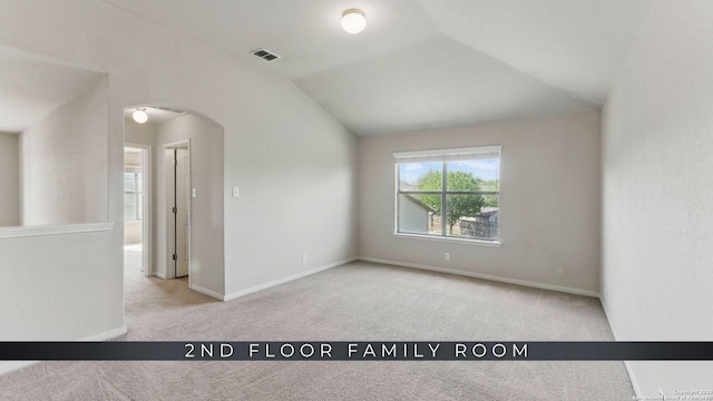 2441 Ibis, New Braunfels, TX 78130 - empty room with carpet, arched walkways, visible vents, lofted ceiling, and baseboards