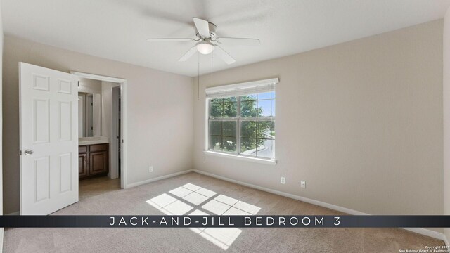 2441 Ibis, New Braunfels, TX 78130 - unfurnished bedroom with baseboards, a ceiling fan, and light carpet