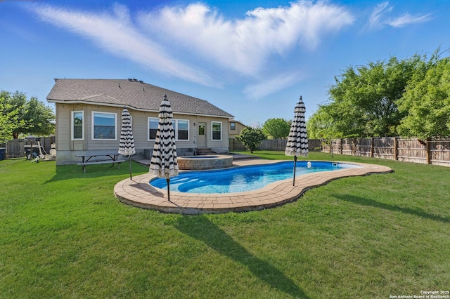 2441 Ibis, New Braunfels, TX 78130 - view of swimming pool featuring a yard, a pool with connected hot tub, and a fenced backyard