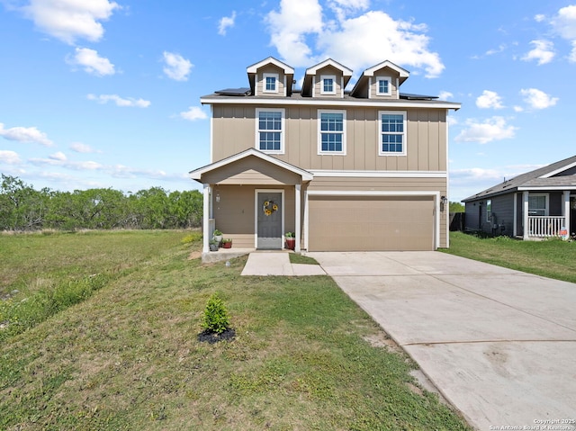 603 Vermilion, San Antonio, TX 78221 - view of front of home featuring driveway, board and batten siding, a front lawn, a garage, and roof mounted solar panels