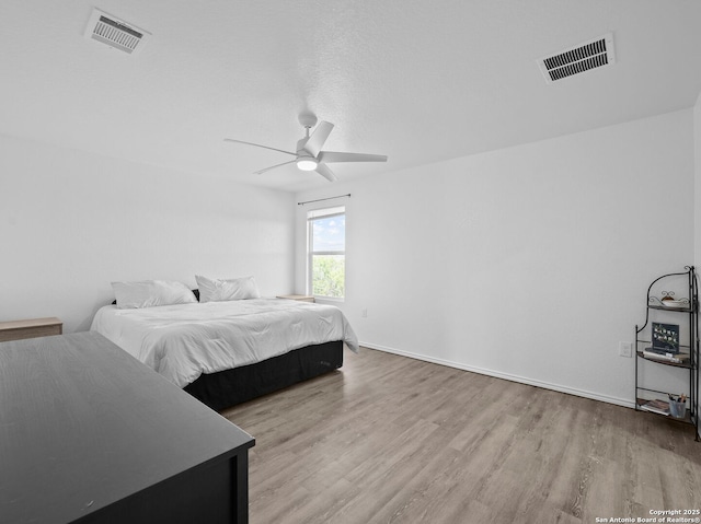 603 Vermilion, San Antonio, TX 78221 - bedroom featuring visible vents, baseboards, a ceiling fan, and wood finished floors