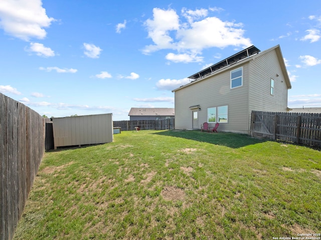 603 Vermilion, San Antonio, TX 78221 - view of yard with an outbuilding, a fenced backyard, and a storage unit