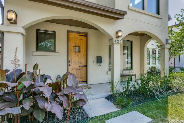 432 E Olmos, San Antonio, TX 78212 - view of exterior entry featuring stucco siding and covered porch
