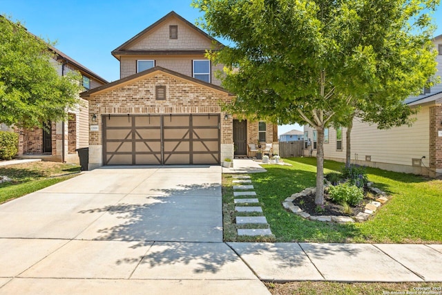 traditional home with an attached garage, brick siding, a front yard, and concrete driveway