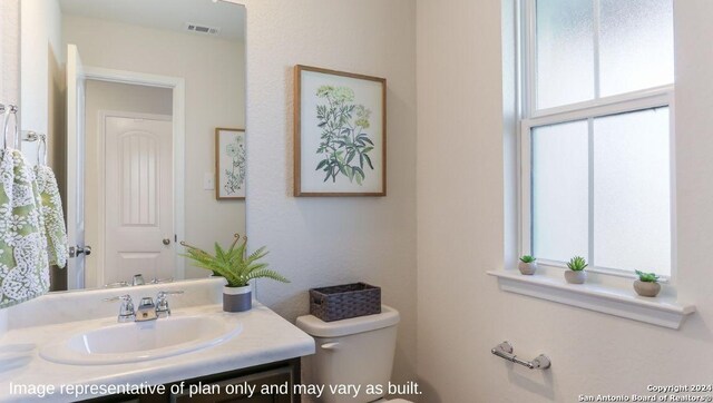 1147 Andean Emerald, San Antonio, TX 78253 - bathroom featuring vanity, visible vents, and toilet