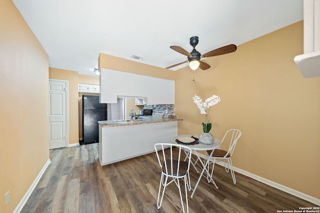 5359 Fredericksburg Rd Unit 808, San Antonio, TX 78229 - dining area with baseboards, a ceiling fan, wood finished floors, and visible vents