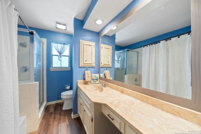 5359 Fredericksburg Rd Unit 808, San Antonio, TX 78229 - bathroom featuring baseboards, toilet, vanity, and a stall shower