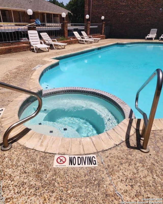 5359 Fredericksburg Rd Unit 808, San Antonio, TX 78229 - pool featuring fence, a patio area, and a community hot tub