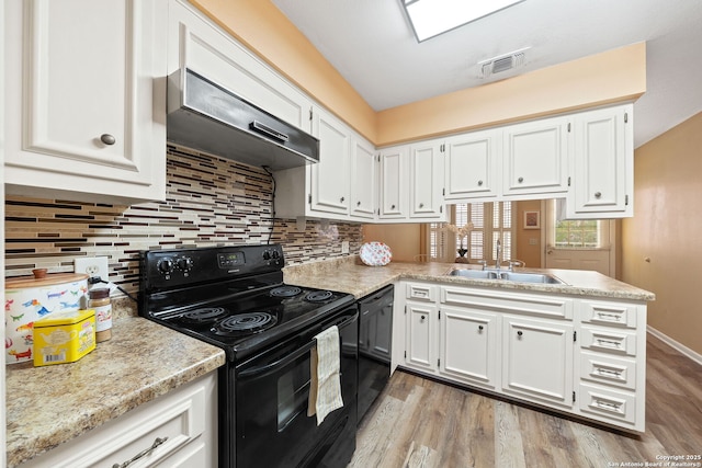 5359 Fredericksburg Rd Unit 808, San Antonio, TX 78229 - kitchen with light countertops, light wood-style floors, visible vents, and black appliances