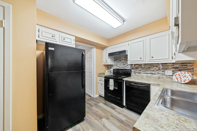 5359 Fredericksburg Rd Unit 808, San Antonio, TX 78229 - kitchen with black appliances, light wood-style flooring, light countertops, white cabinets, and under cabinet range hood