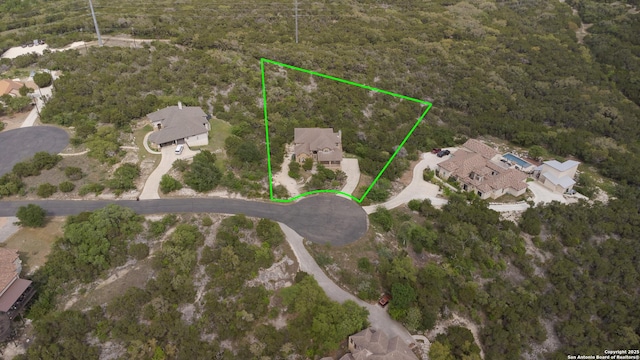 12307 Van De Carr, Helotes, TX 78023 - drone / aerial view featuring a wooded view