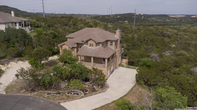 12307 Van De Carr, Helotes, TX 78023 - drone / aerial view featuring a forest view