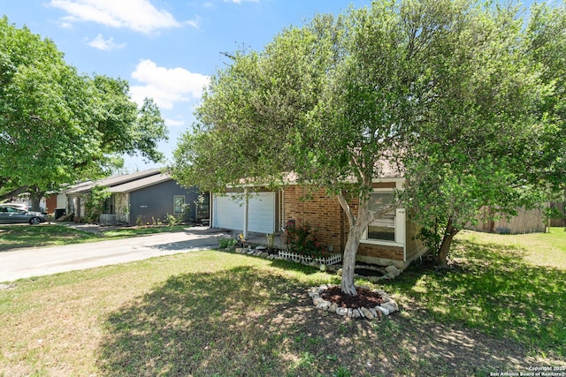 5454 Vista Ct, San Antonio, TX 78247 - view of front of house featuring a front yard, brick siding, a garage, and driveway