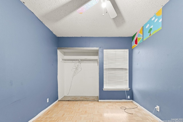 5454 Vista Ct, San Antonio, TX 78247 - unfurnished bedroom with a closet, baseboards, and a textured ceiling