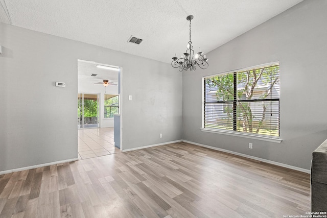 5454 Vista Ct, San Antonio, TX 78247 - unfurnished room featuring visible vents, baseboards, light wood-type flooring, and a textured ceiling