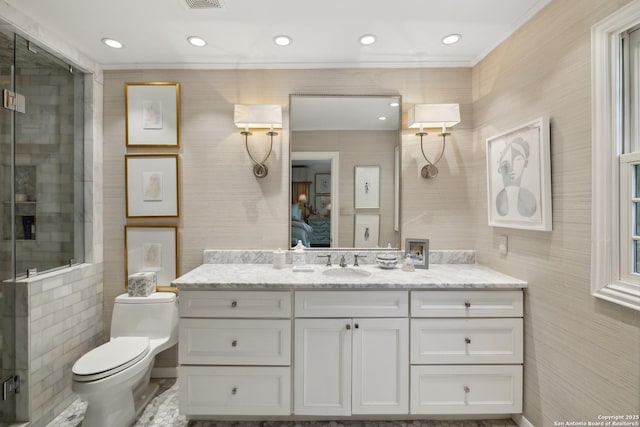 643 Terrell Rd, Terrell Hills, TX 78209 - ensuite bathroom with crown molding, vanity, toilet, a stall shower, and recessed lighting