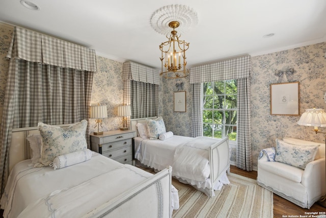 643 Terrell Rd, Terrell Hills, TX 78209 - bedroom featuring crown molding, wood finished floors, a chandelier, and wallpapered walls