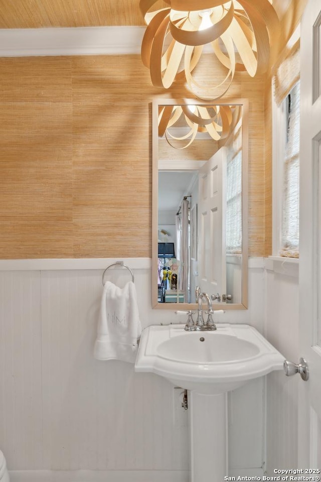 643 Terrell Rd, Terrell Hills, TX 78209 - bathroom with a wainscoted wall, a chandelier, and wood walls