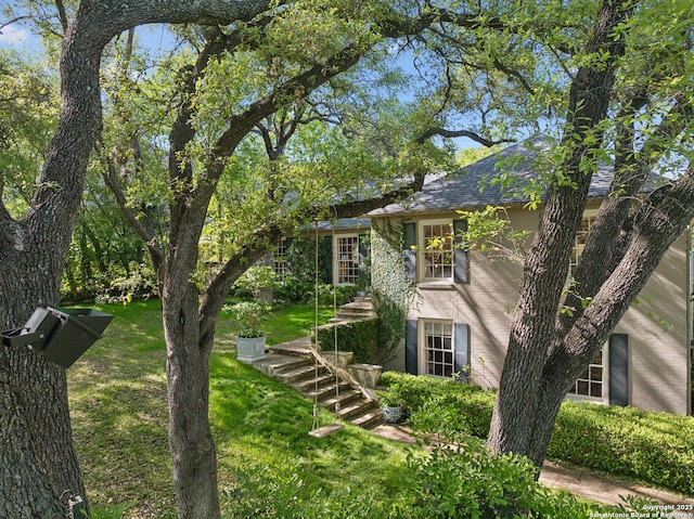 643 Terrell Rd, Terrell Hills, TX 78209 - view of front of house featuring stairs, a front yard, and roof with shingles