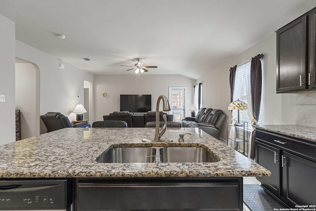 8018 Radiant Sunset, San Antonio, TX 78252 - kitchen featuring arched walkways, a ceiling fan, dishwasher, a sink, and open floor plan
