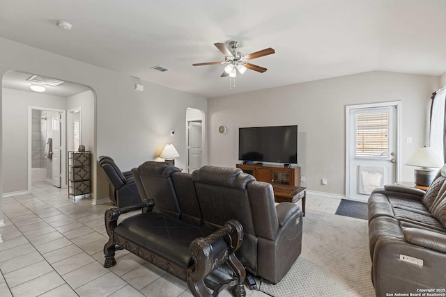8018 Radiant Sunset, San Antonio, TX 78252 - living area featuring arched walkways, visible vents, a ceiling fan, and light tile patterned flooring