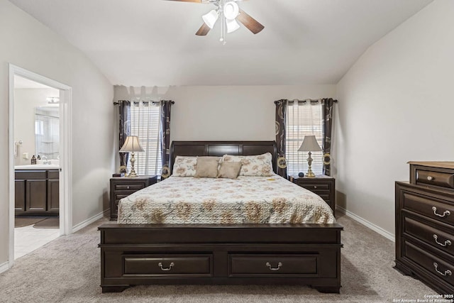 8018 Radiant Sunset, San Antonio, TX 78252 - bedroom with baseboards, light colored carpet, ensuite bath, and vaulted ceiling