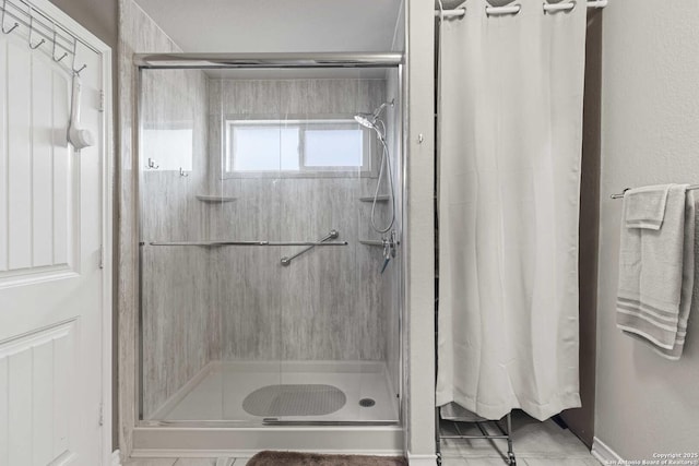 8018 Radiant Sunset, San Antonio, TX 78252 - full bathroom featuring tile patterned floors, baseboards, and a stall shower