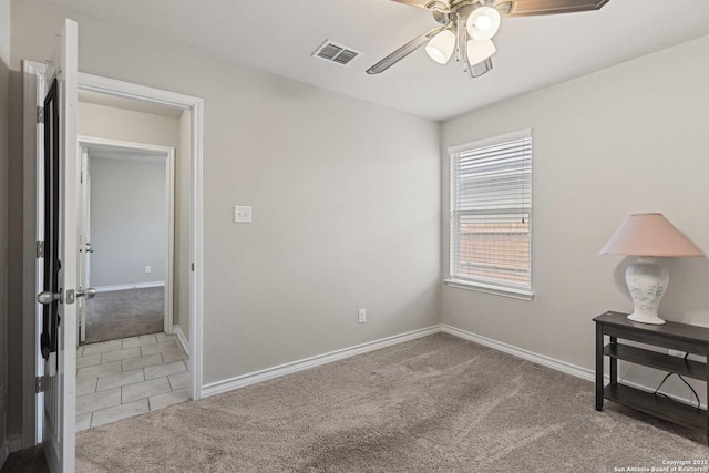 8018 Radiant Sunset, San Antonio, TX 78252 - interior space featuring ceiling fan, light colored carpet, visible vents, light tile patterned flooring, and baseboards