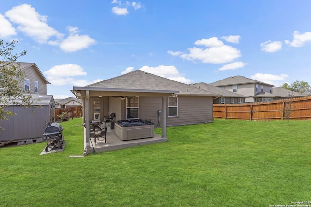 8018 Radiant Sunset, San Antonio, TX 78252 - rear view of house featuring an outbuilding, a fenced backyard, a patio, and a lawn