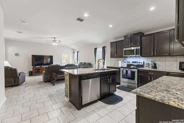 8018 Radiant Sunset, San Antonio, TX 78252 - kitchen featuring ceiling fan, light stone countertops, visible vents, a sink, and stainless steel appliances