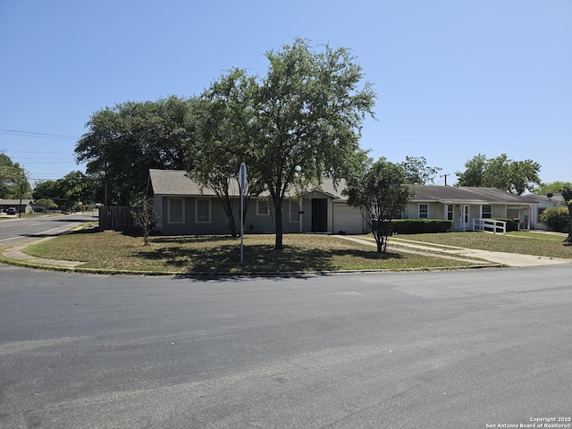 390 Harcourt, San Antonio, TX 78223 - ranch-style home with a garage and driveway