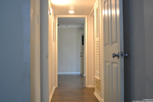 390 Harcourt, San Antonio, TX 78223 - corridor featuring dark wood-type flooring and baseboards