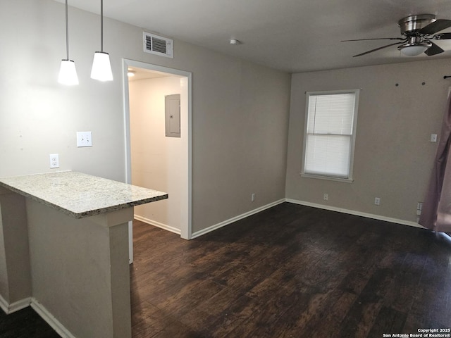 390 Harcourt, San Antonio, TX 78223 - unfurnished living room featuring a ceiling fan, baseboards, dark wood-style floors, and visible vents