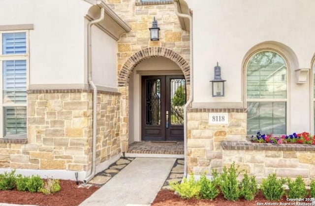 8118 Vanity, San Antonio, TX 78256 - doorway to property with stone siding and stucco siding