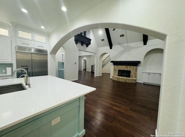 8118 Vanity, San Antonio, TX 78256 - kitchen with built in refrigerator, lofted ceiling with beams, a sink, light countertops, and open floor plan