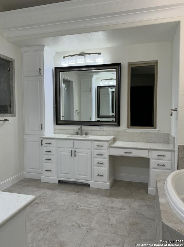 8118 Vanity, San Antonio, TX 78256 - bathroom featuring a bathing tub, baseboards, and vanity