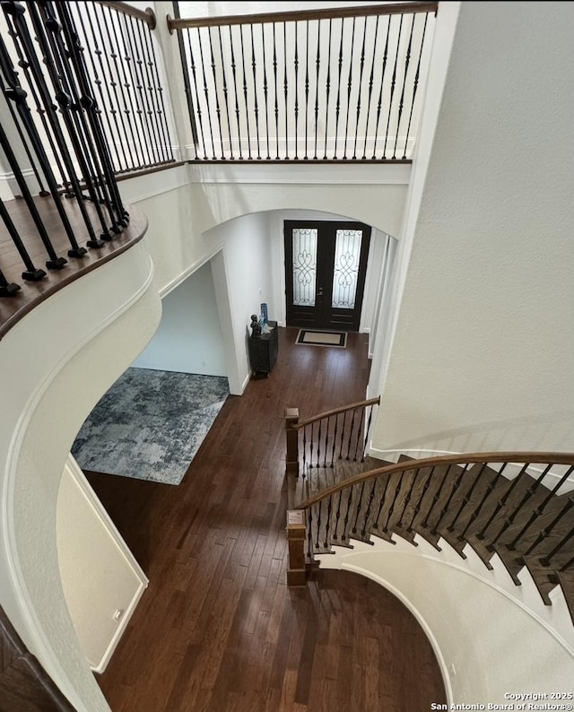 8118 Vanity, San Antonio, TX 78256 - entryway featuring arched walkways, a high ceiling, wood-type flooring, and stairway