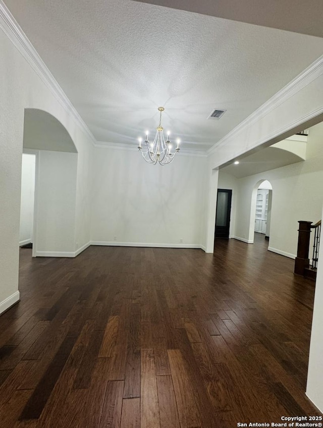 8118 Vanity, San Antonio, TX 78256 - unfurnished room with a chandelier, arched walkways, crown molding, and dark wood-style floors