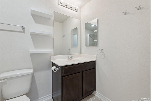 13506 Whisper Bnd, San Antonio, TX 78252 - bathroom featuring tile patterned floors, vanity, baseboards, and toilet