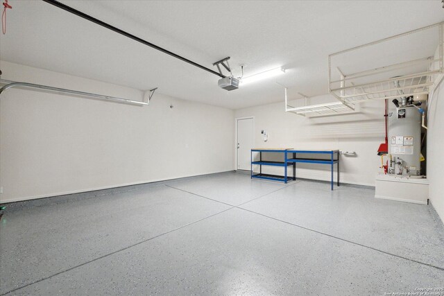 13506 Whisper Bnd, San Antonio, TX 78252 - garage featuring a garage door opener, baseboards, and gas water heater