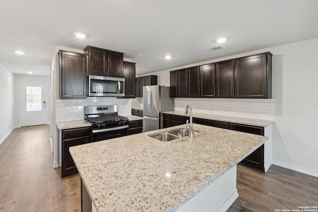 13506 Whisper Bnd, San Antonio, TX 78252 - kitchen featuring stainless steel appliances, visible vents, baseboards, and a sink