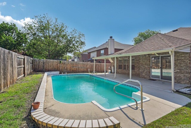view of pool featuring a patio, a fenced backyard, and a fenced in pool