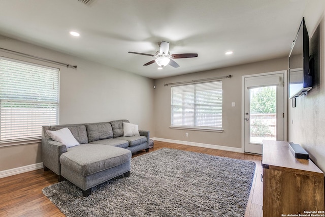 living area with recessed lighting, baseboards, a ceiling fan, and wood finished floors