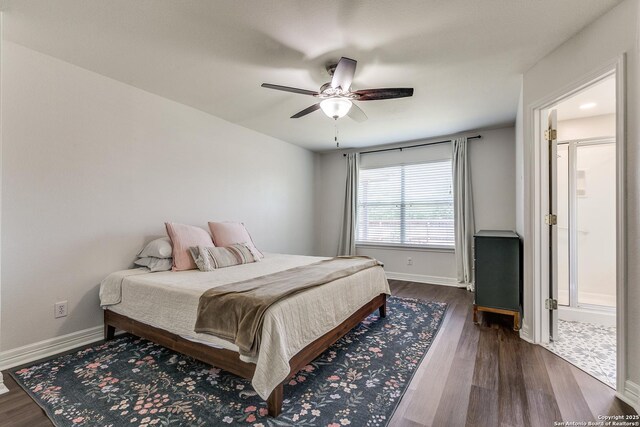 bedroom featuring dark wood-style flooring, baseboards, and ceiling fan