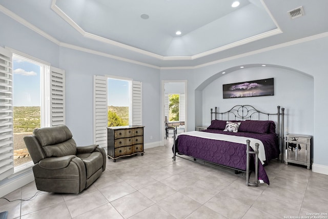 bedroom featuring baseboards, light tile patterned floors, crown molding, visible vents, and a tray ceiling